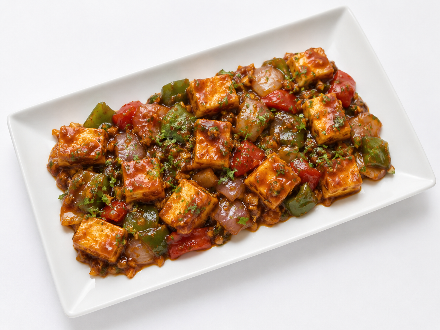 Chilli Paneer queso indio salteado con pimientos en salsa picante en Desi Galli Barcelona